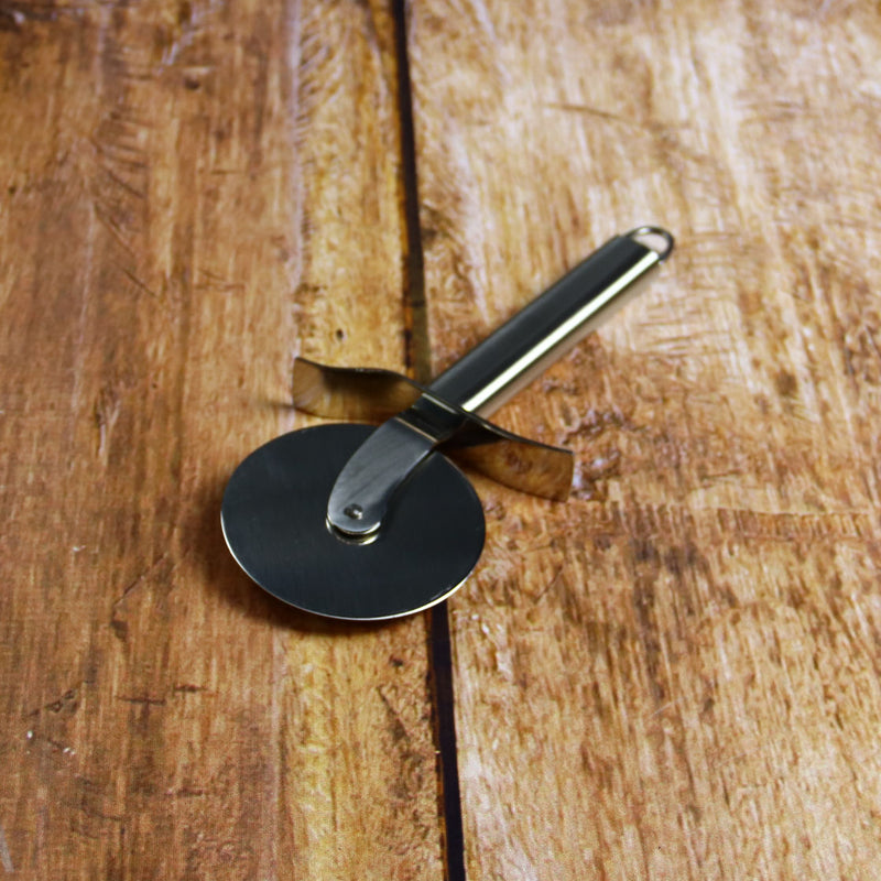 Cristel Pizza cutter on Wood Table