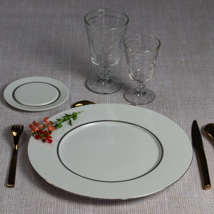 Degrenne tabletop set on linen tablecloth