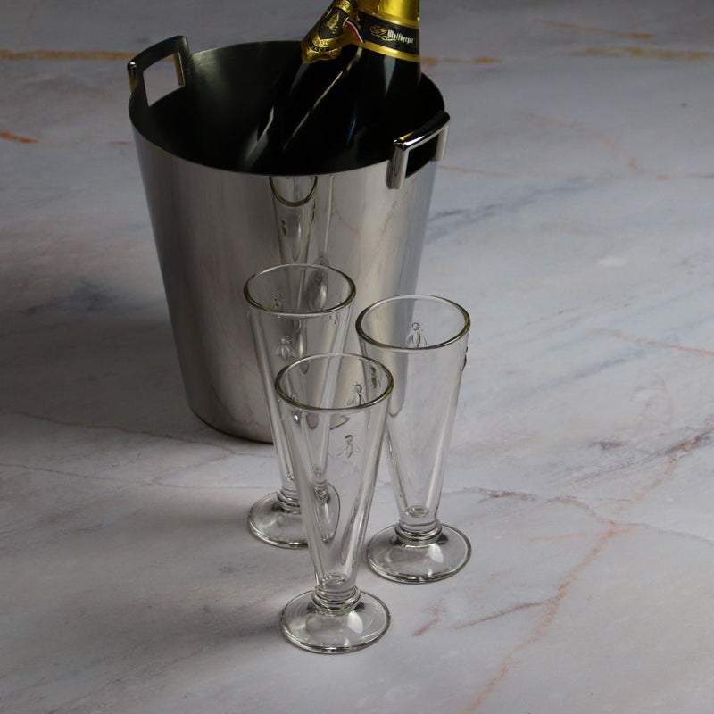 Champagne bucket with Champagne glass on marble